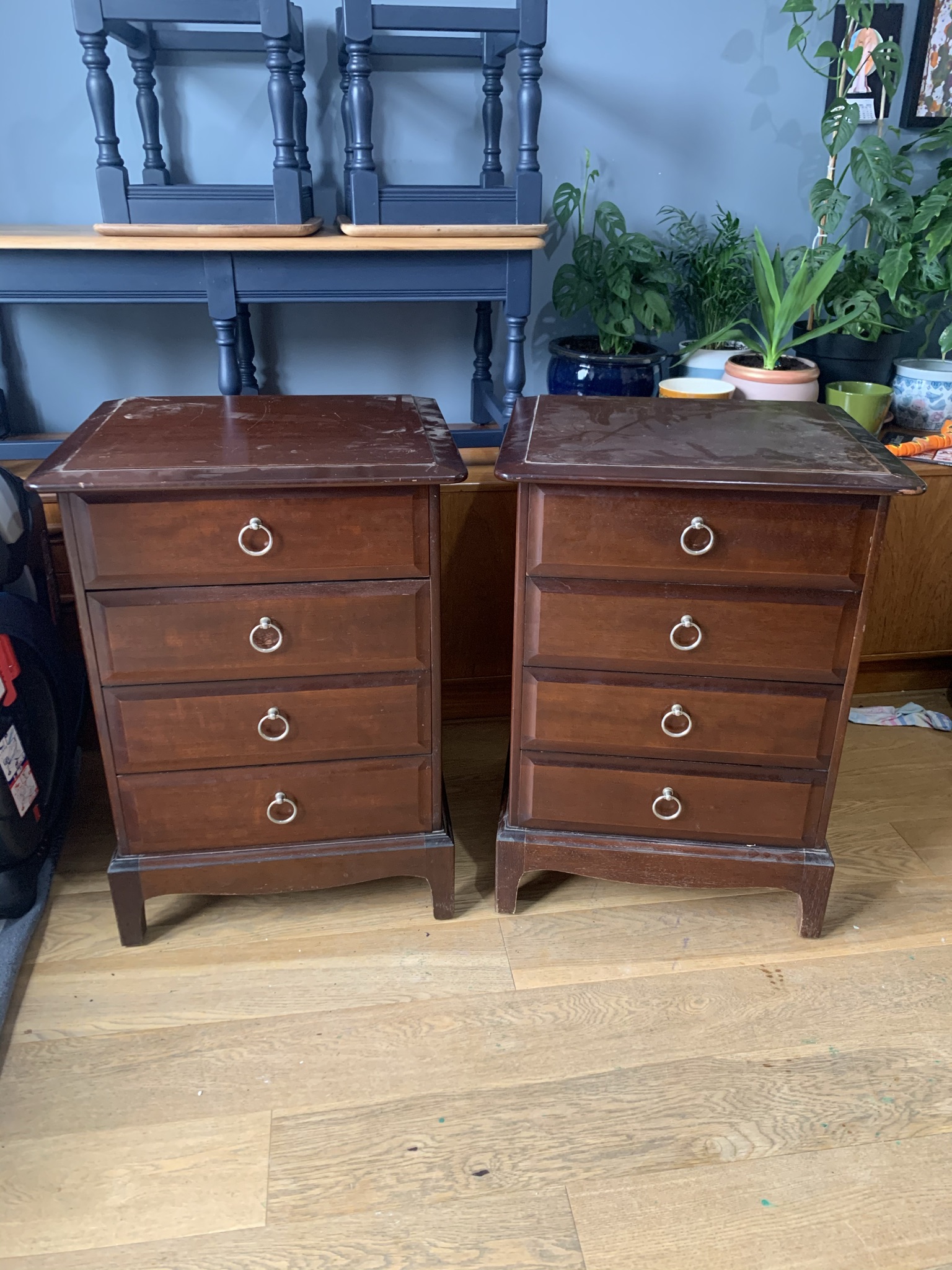 Worn brown bedside tables before restoration